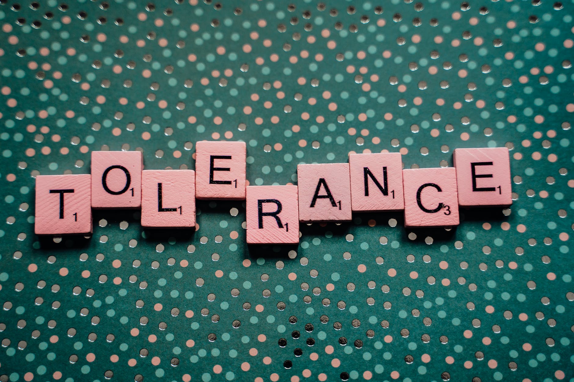 scrabble tiles spelling out the word tolerance